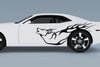 howling wolf vinyl cut graphics on the side of white camaro sports car